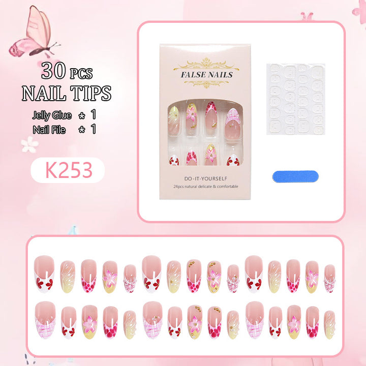 Artificial nails with floral accents and glitter decorations Bowlift