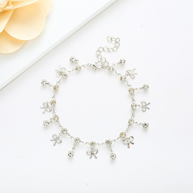 Crystal Bow Charm Bracelet Bowlift