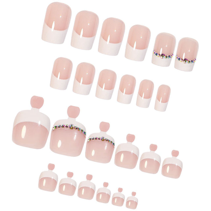 Acrylic nail set with elegant French design and rhinestone embellishments Bowlift