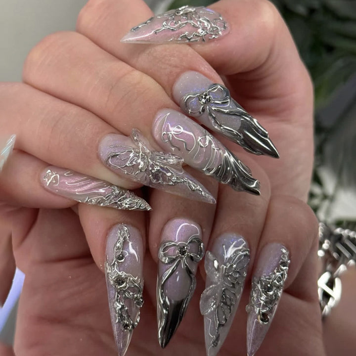 Artful stiletto nails with delicate silver casting decoration Bowlift