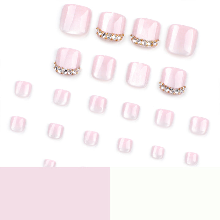 Artful toenail art with glitter and rhinestone decorations Bowlift