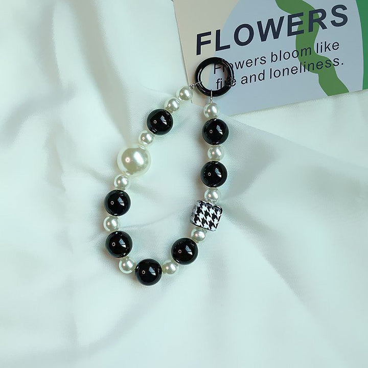 Elegant Pearl and Black Bead Charm Bracelet Bowlift