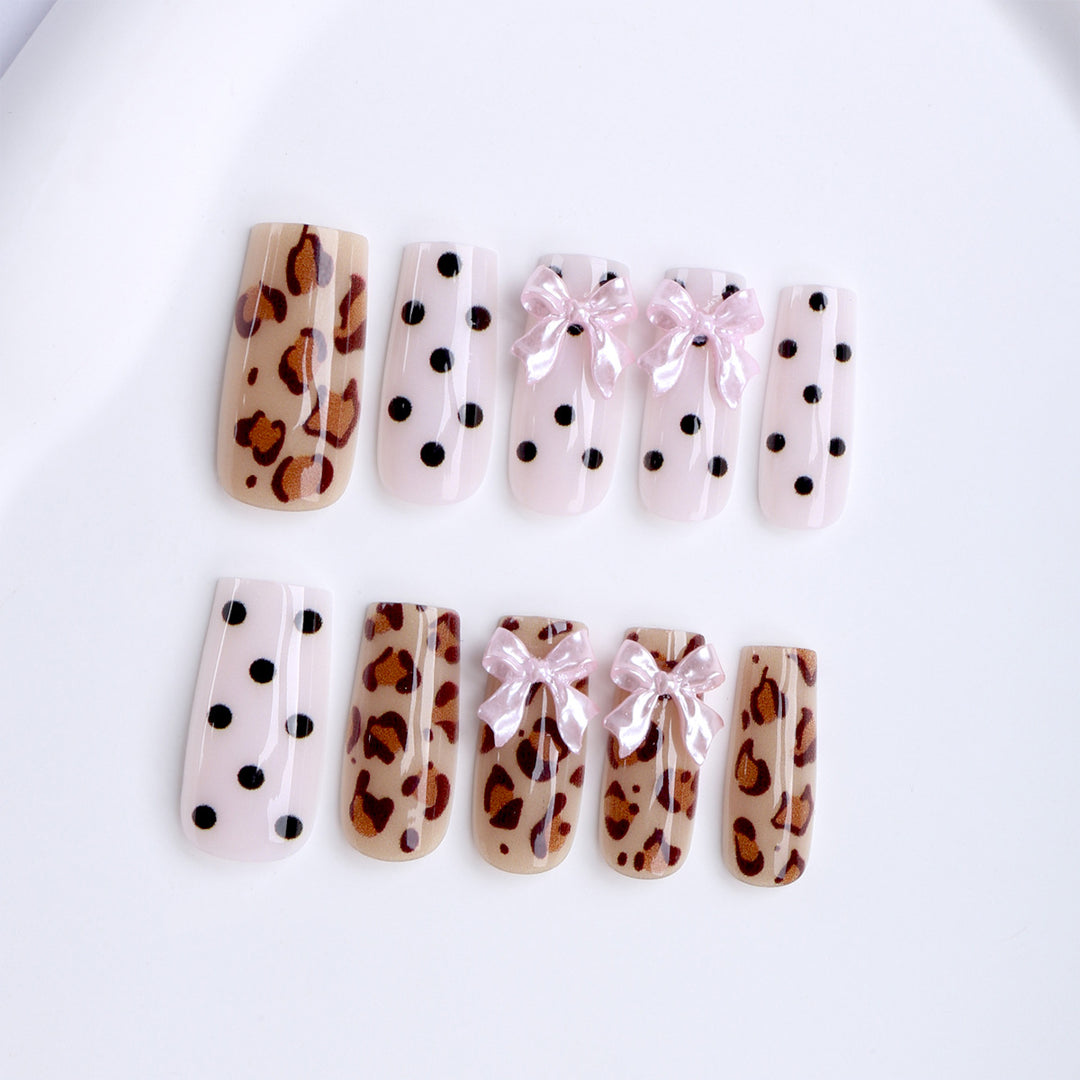 Creative artificial nails with bows and dots Bowlift
