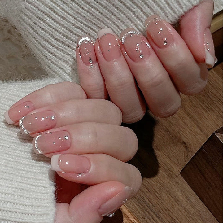 Glamorous artificial nails with filigree rhinestone details Bowlift