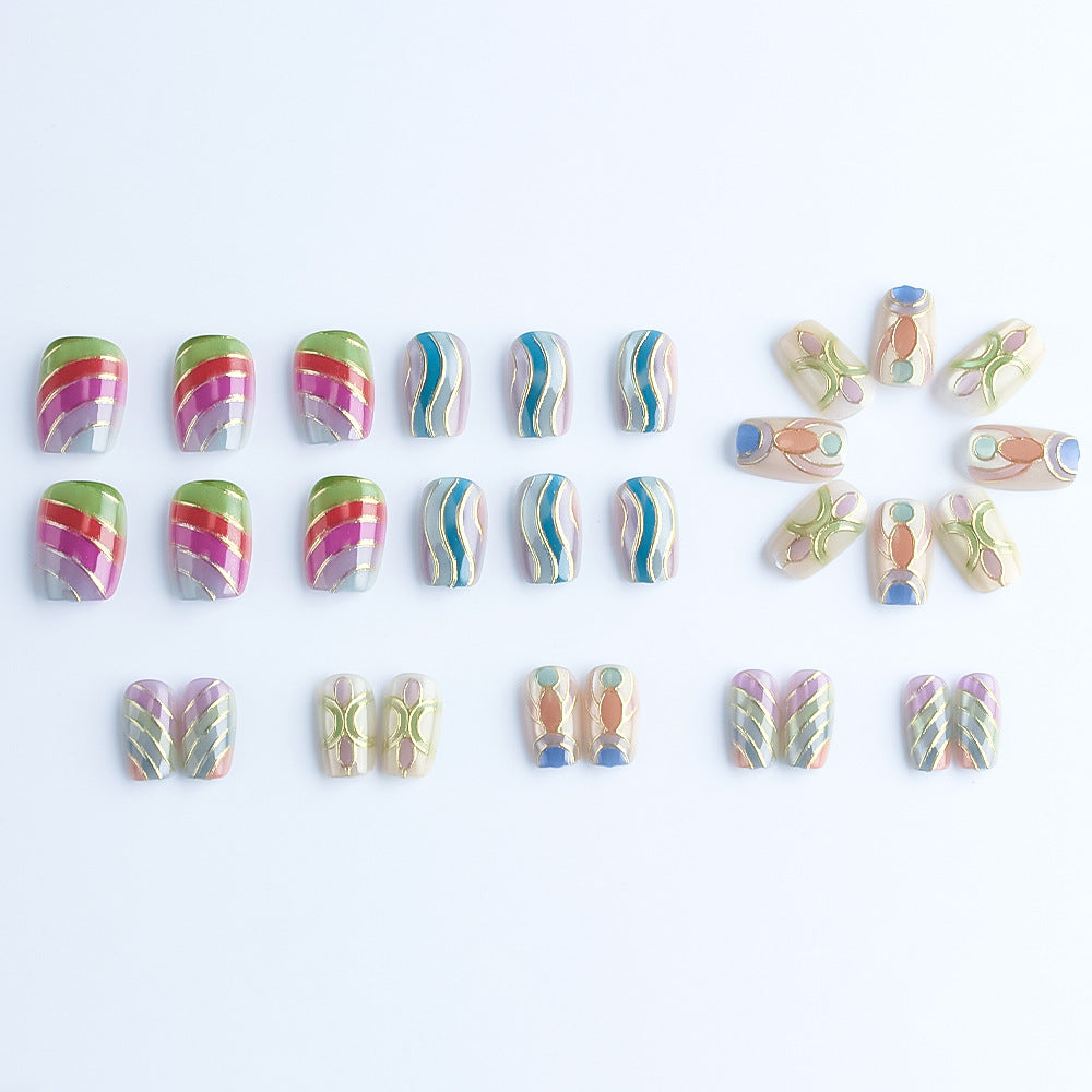 Artistic Press-On Nail Set with Gold Accents Bowlift