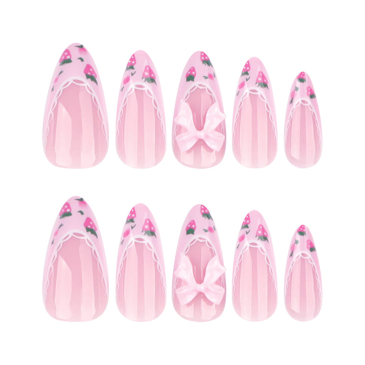 Artful stiletto nails with floral accents and bow embellishments Bowlift