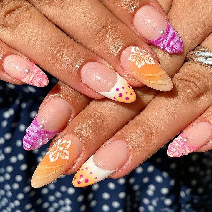 Acrylic nail set with exotic flower patterns and glitter accents Bowlift