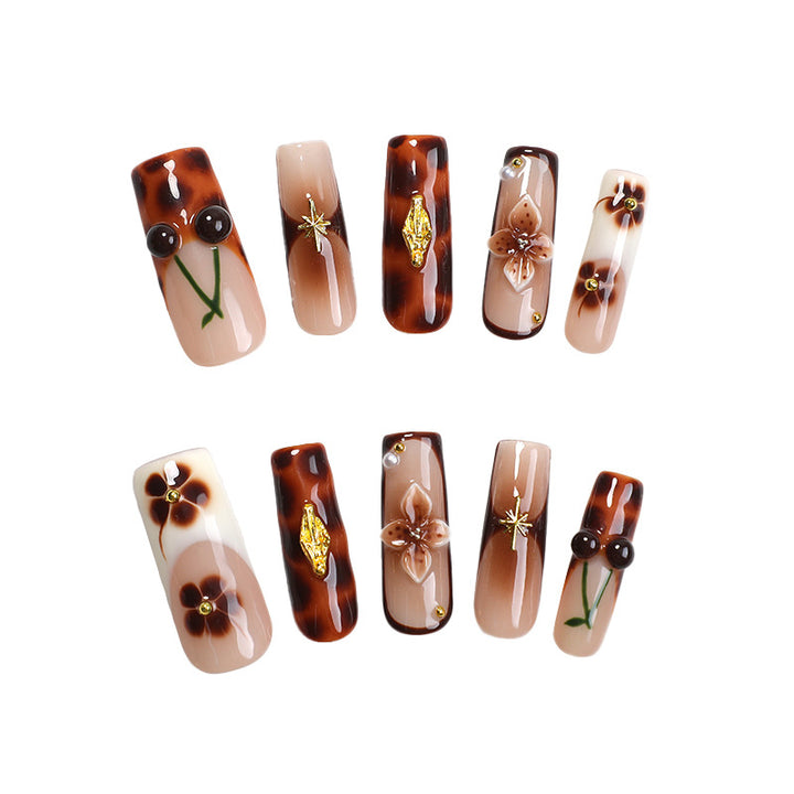 Elegant nail art set with floral and golden accents Bowlift
