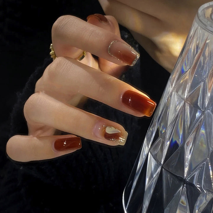 Elegant Glossy Press-On Nails with Gold Glitter Accents Bowlift