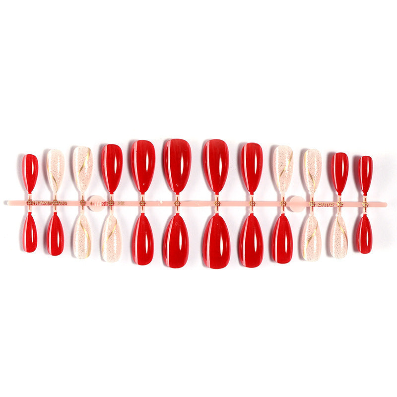 Artificial nail set with shiny red surface and stylish accents Bowlift