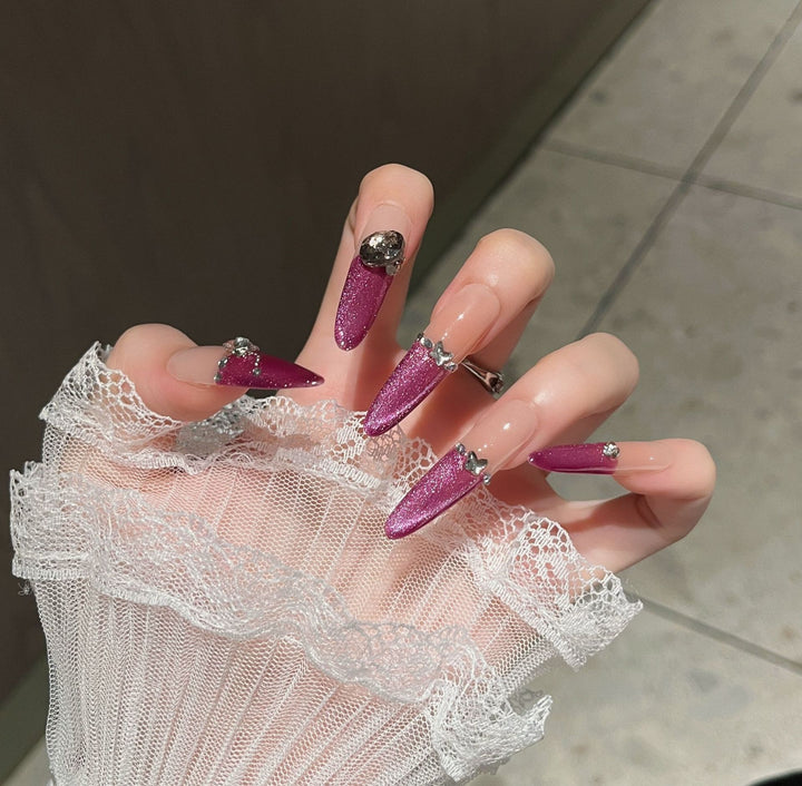 Artistic Stiletto Press-On Nail Art with Glimmering Accents Bowlift