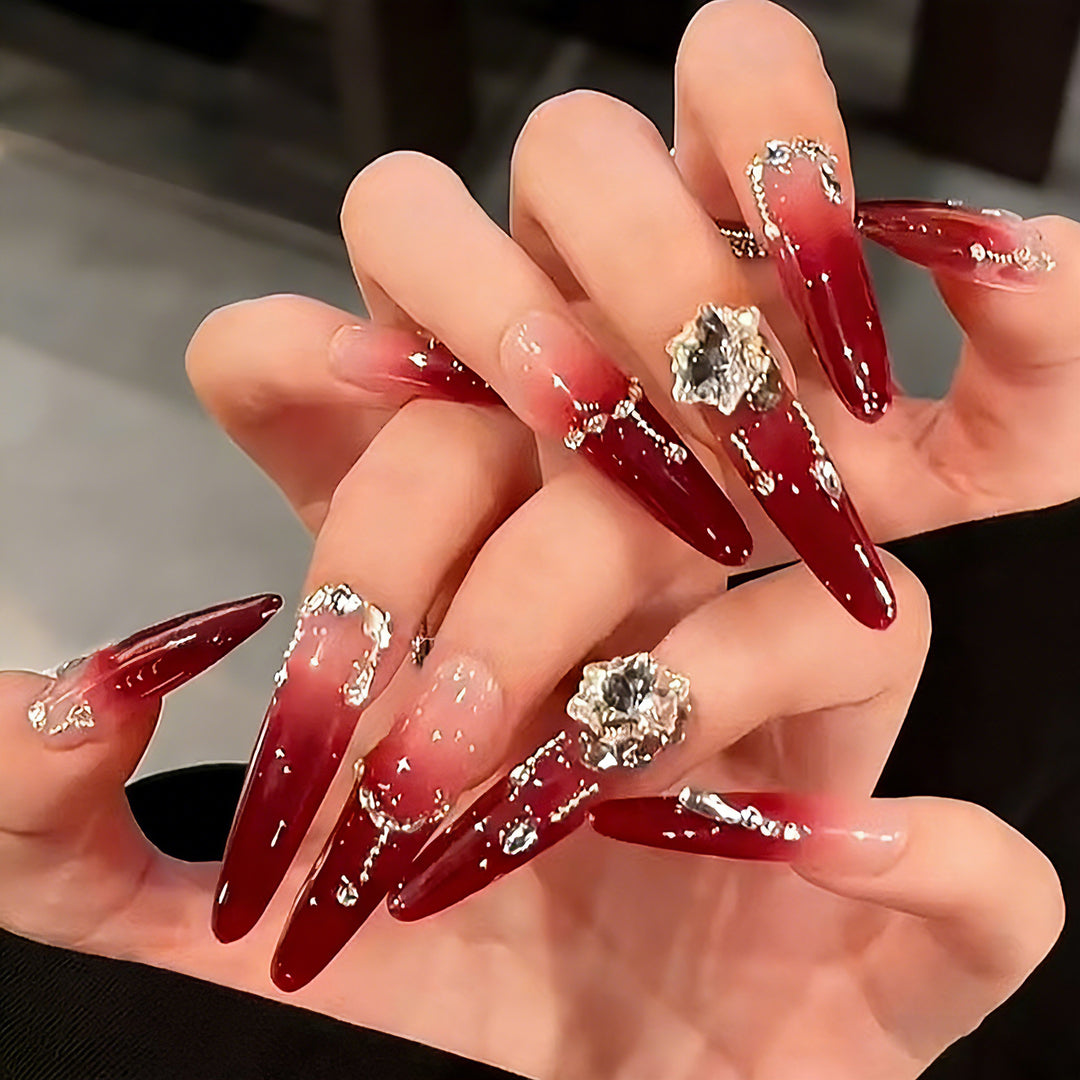Artificial nails with elegant glitter and jewelry accents Bowlift