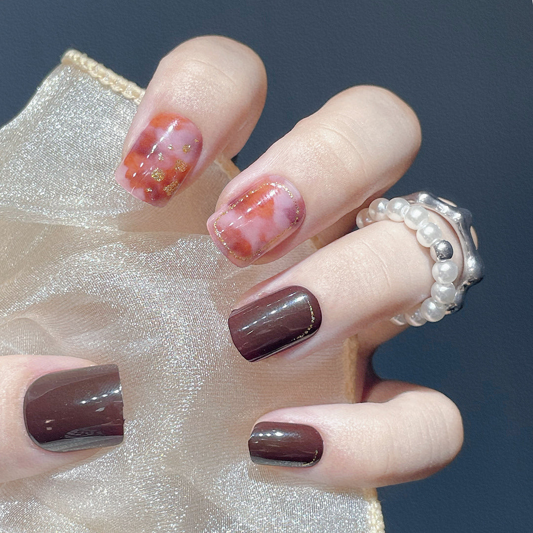 Artistic Press-On Nail Set with Marble and Metallic Accents Bowlift