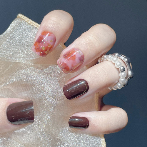 Artistic Press-On Nail Set with Marble and Metallic Accents Bowlift