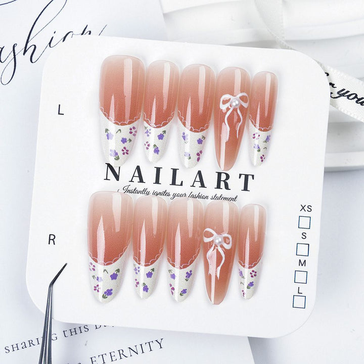 Artistic Stiletto Press-On Nail Set with Floral Embellishments Bowlift