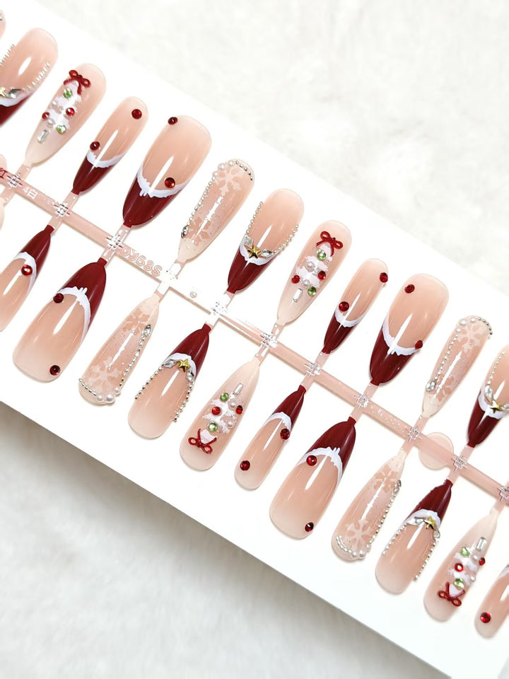 Artificial nails with festive designs and glitter accents Bowlift