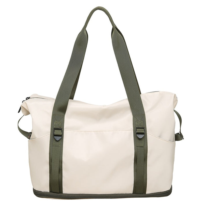 Sporty shoulder bag with water-repellent material and sturdy carrying handles Bowlift