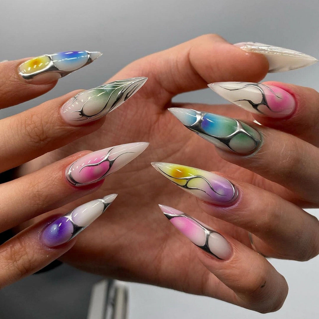 Artful stiletto nails with transparent design and colorful accents Bowlift