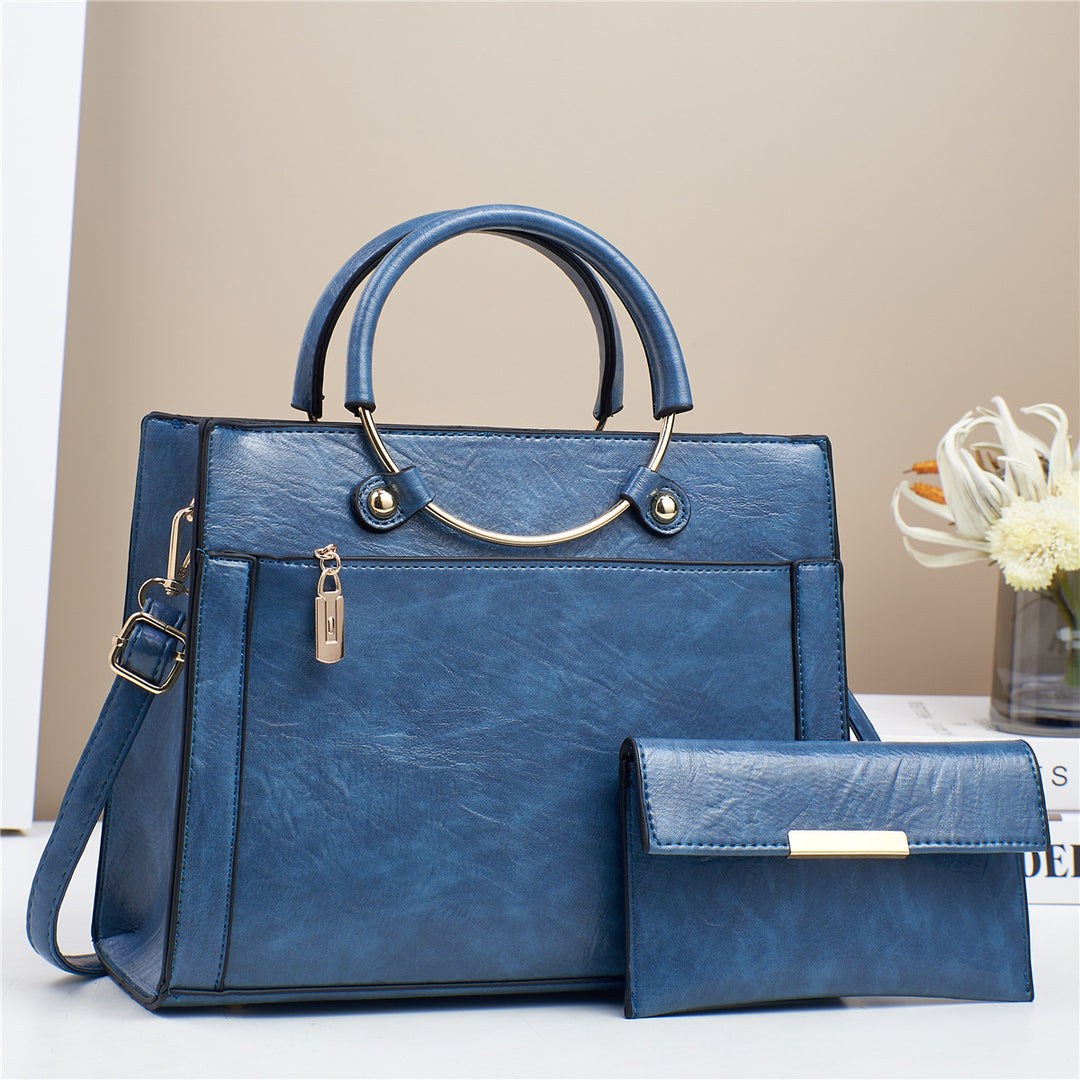 Elegant handbag with detachable shoulder strap and matching wallet Bowlift