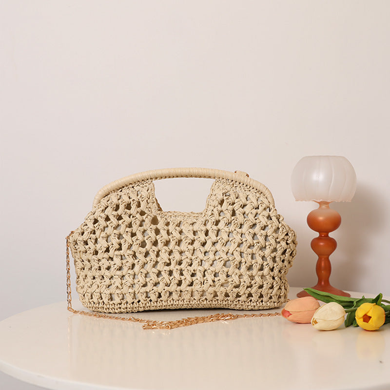 Handcrafted rattan bag with elegant handles and chain straps Bowlift