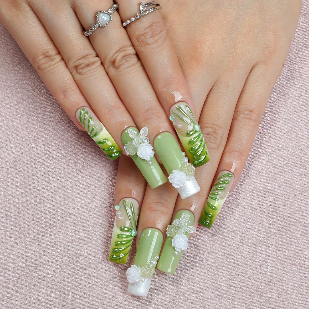 Creative nail set with floral design and delicate accents Bowlift