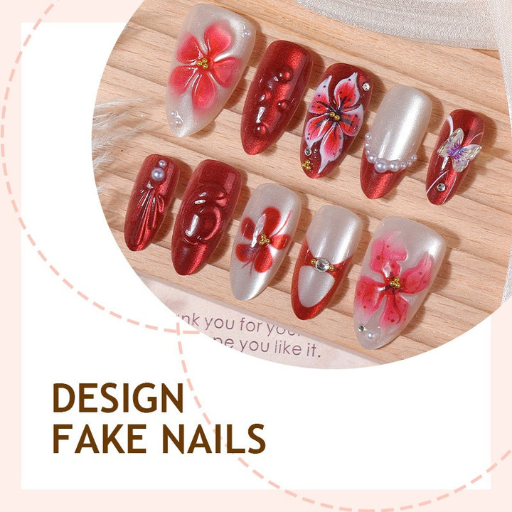 Artificial nail set with floral designs and glamorous accents Bowlift
