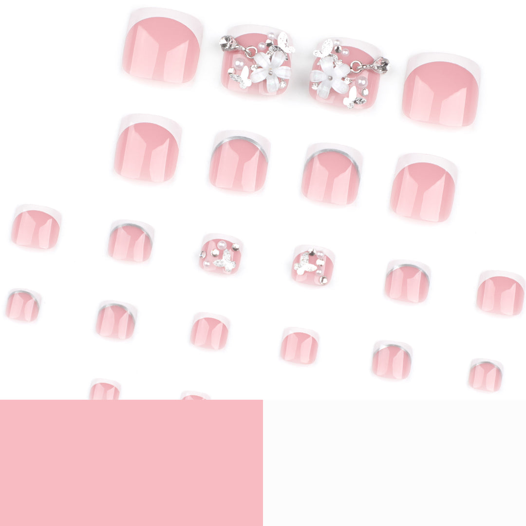 Artful toenail design with elegant flower and glitter accents Bowlift