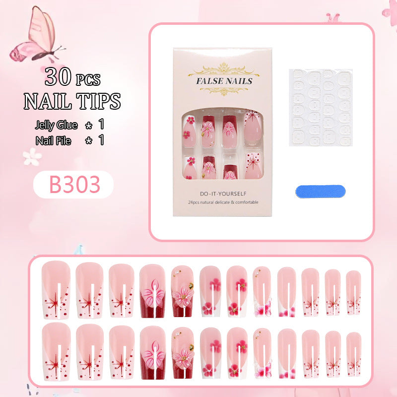 Artificial nail set with floral detail and glitter effects Bowlift