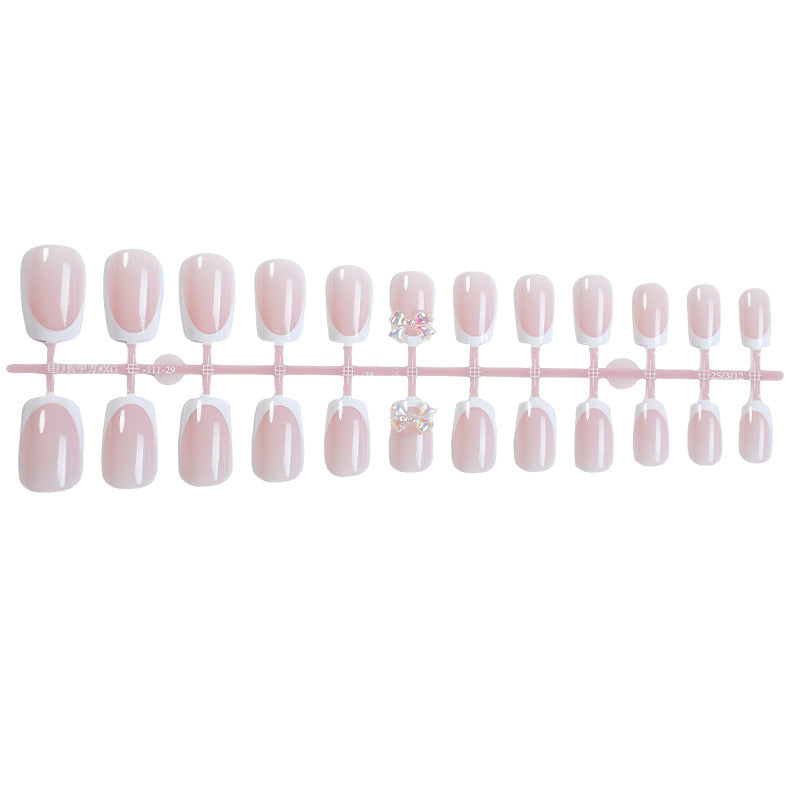 Elegant artificial nails with delicate glitter and decorative accents Bowlift