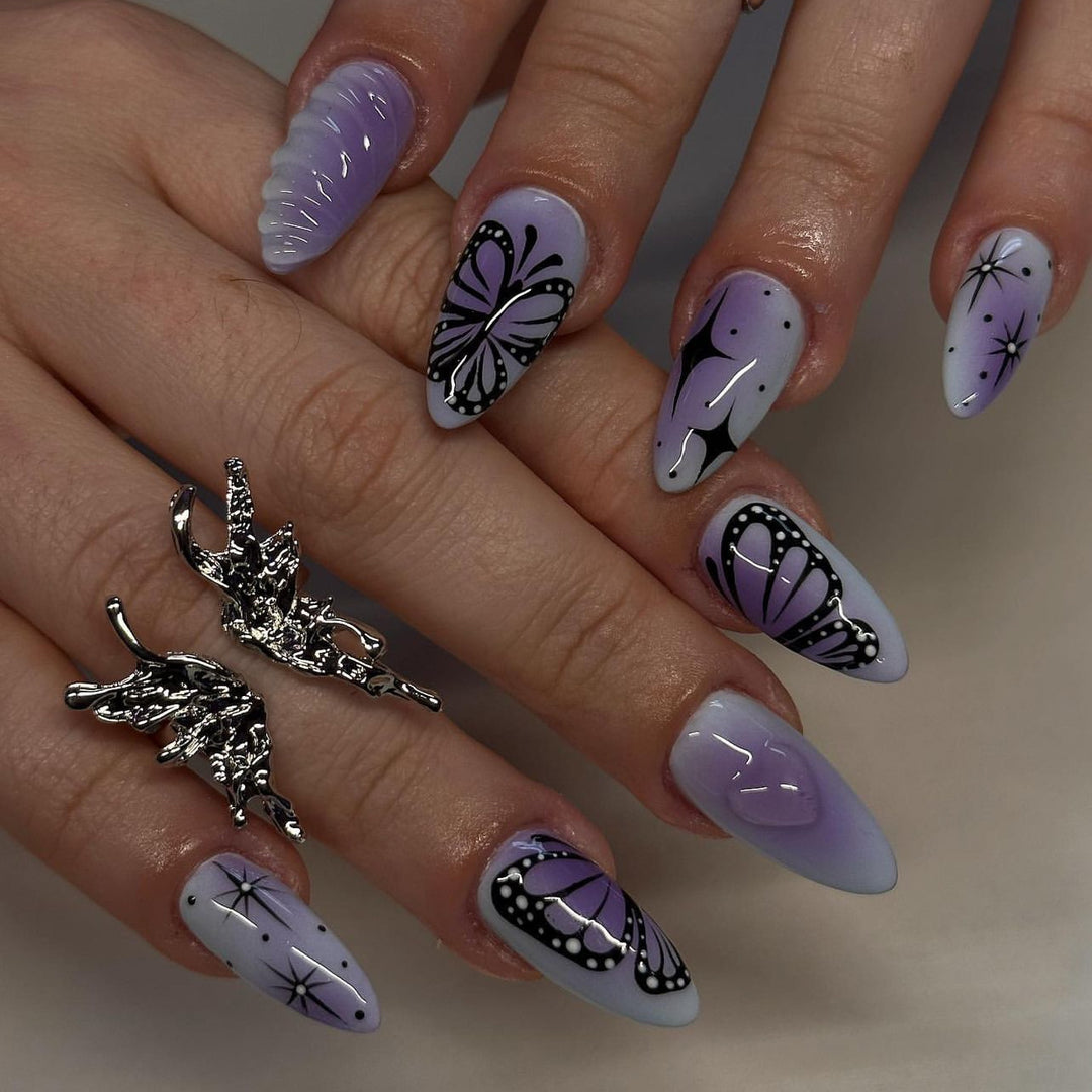 Artful stiletto nails with elegant butterfly design Bowlift