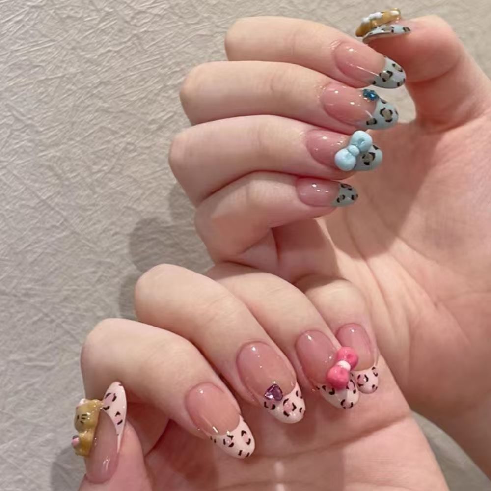 Artistic Press-On Nail Set with Floral and Glossy Accents Bowlift