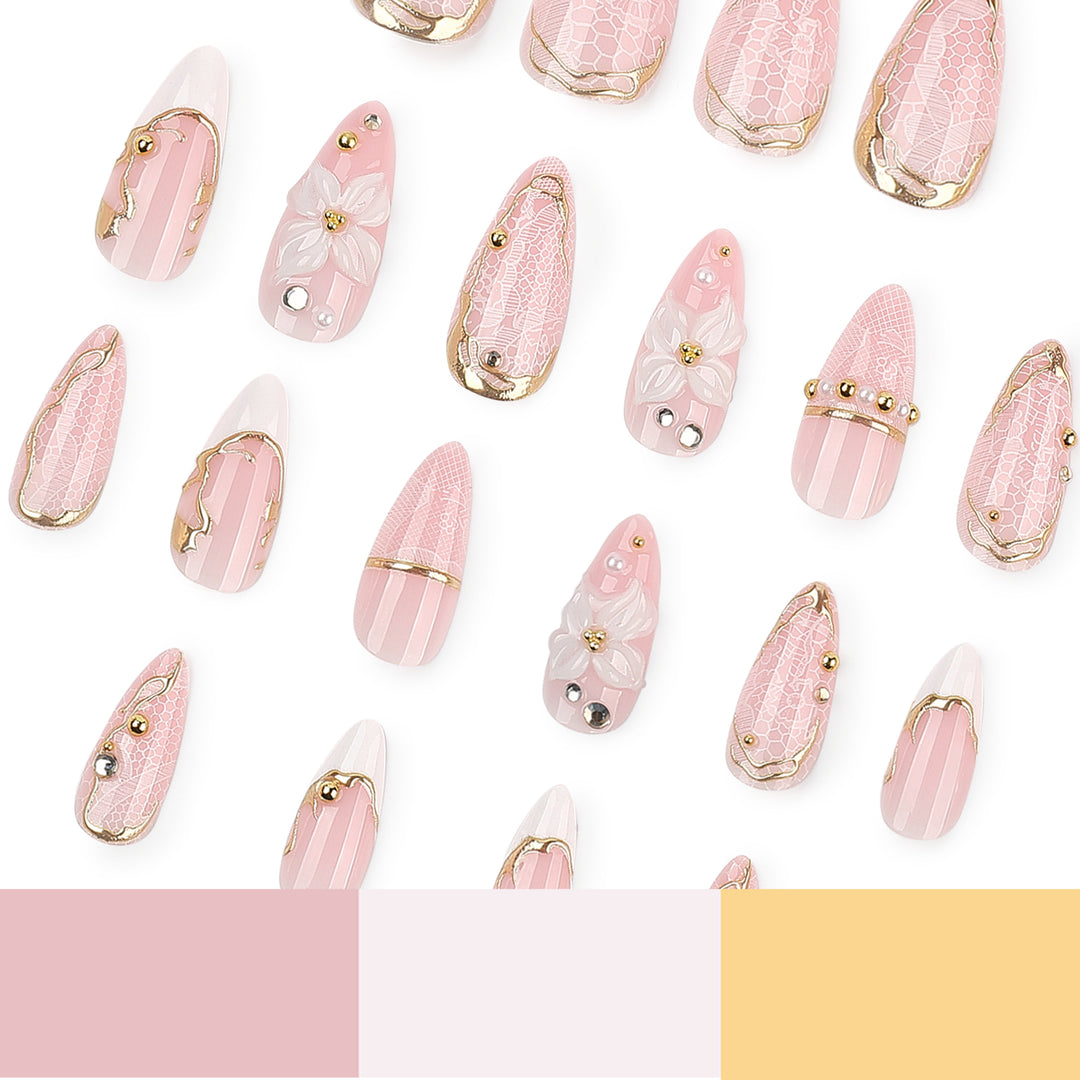 Artful nail extensions with delicate flower and gold embellishments Bowlift