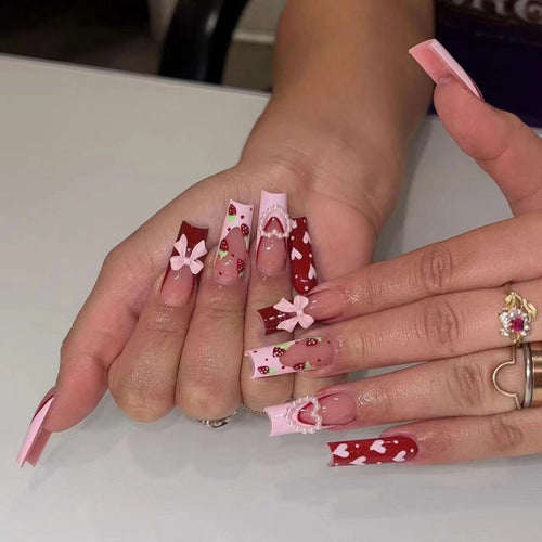 Decorative Long Press-On Nails with Hearts and Floral Accents Bowlift