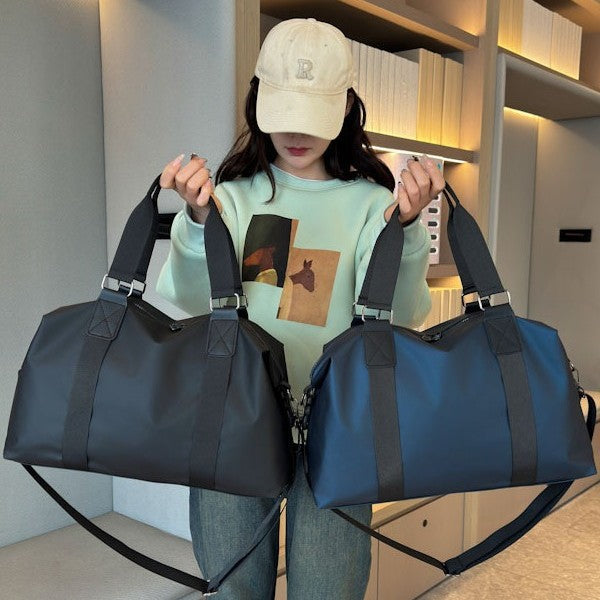 Athletic travel bag made of weather-resistant material with adjustable carrying handles Bowlift