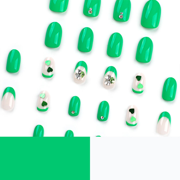Artistic Nail Extensions with Lovable Heart Patterns and Glitter Accents Bowlift