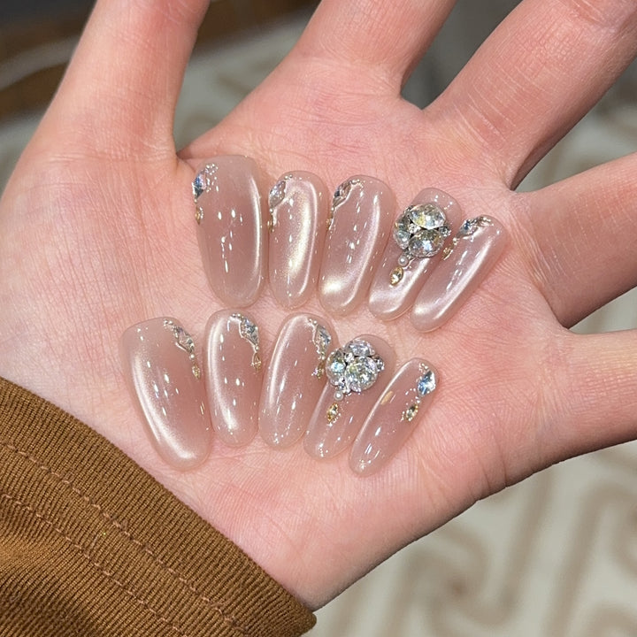 Glamorous artificial nails with rhinestone embellishments Bowlift