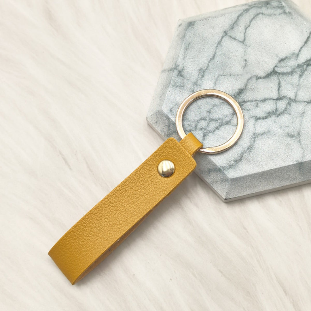 Unisex keychain made of high-quality synthetic leather with elegant metal embellishment Bowlift