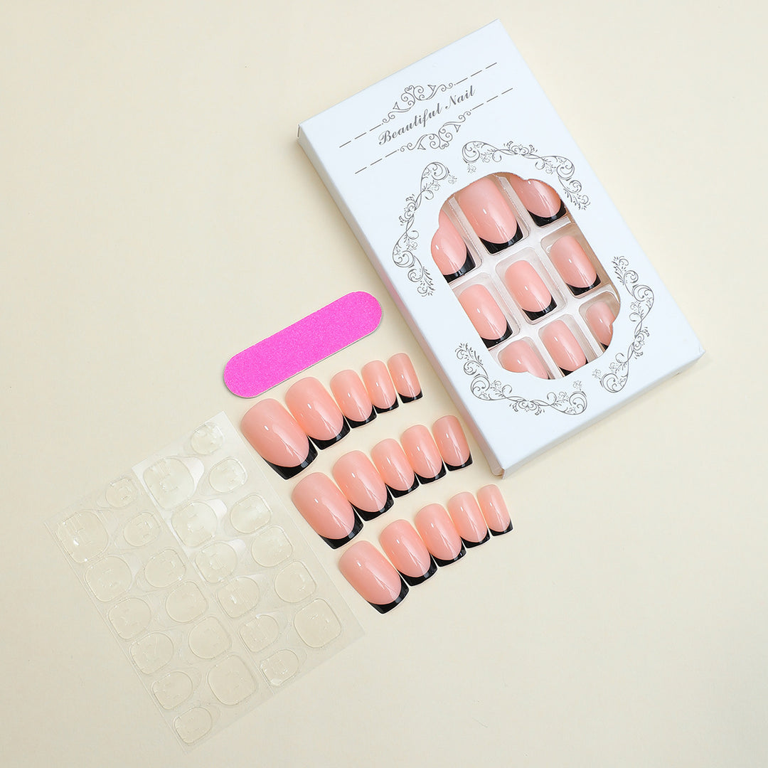 Artificial nail set with elegant French tip design and modern accents Bowlift