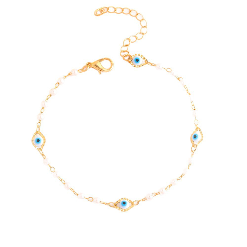Elegant Pearl and Eye Charm Necklace Bowlift