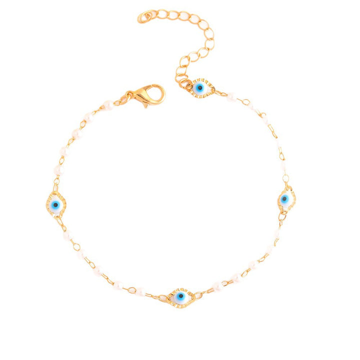 Elegant Pearl and Eye Charm Necklace Bowlift