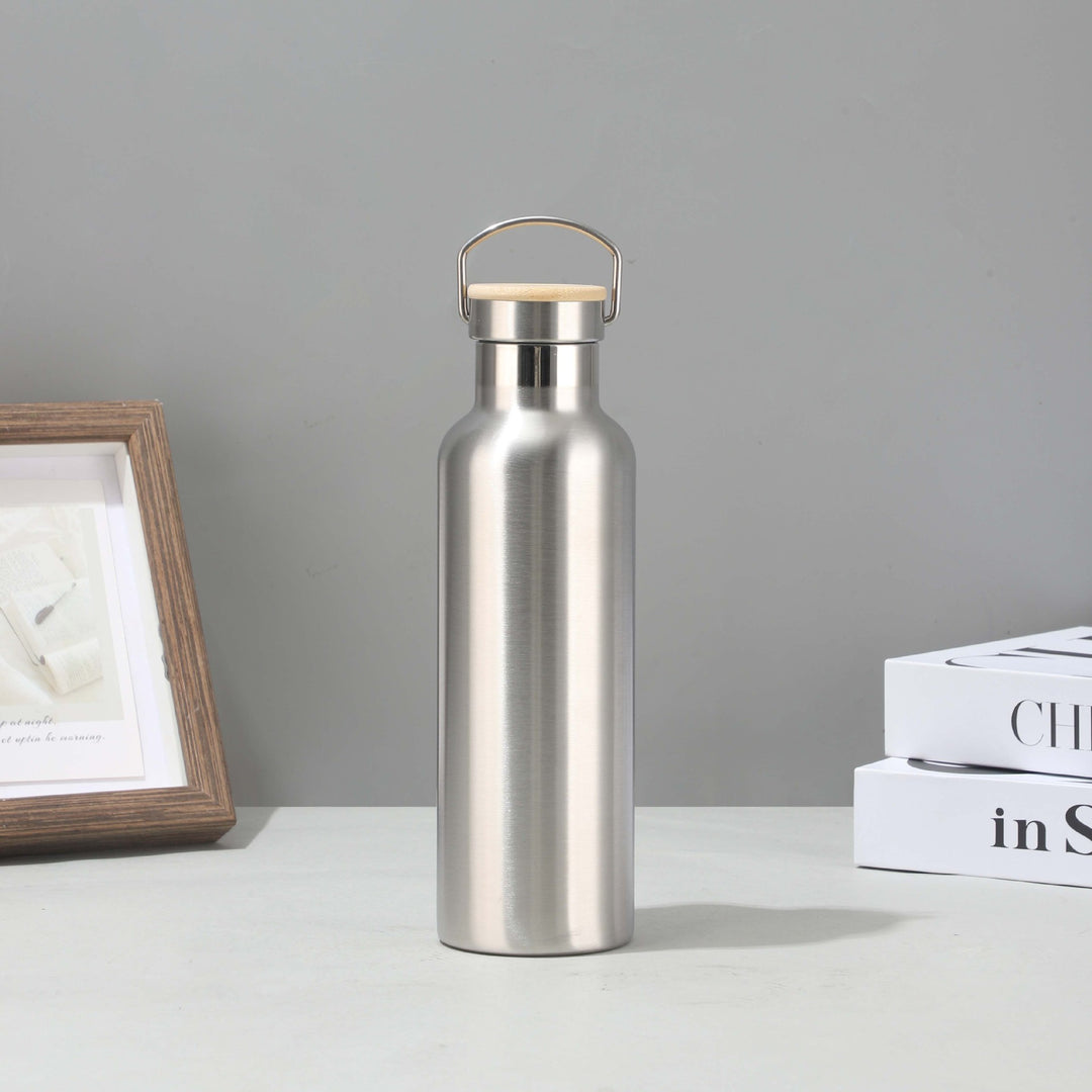 Women's stainless steel insulated drinking bottle with sustainable bamboo lid Bowlift