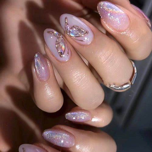 Glamorous artificial nails with rhinestone and glitter decorations Bowlift