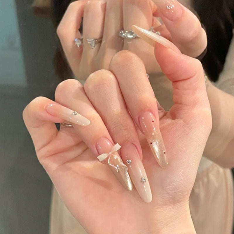 Elegant Stiletto Press-On Nails with Decorative Bow and Rhinestone Accents Bowlift
