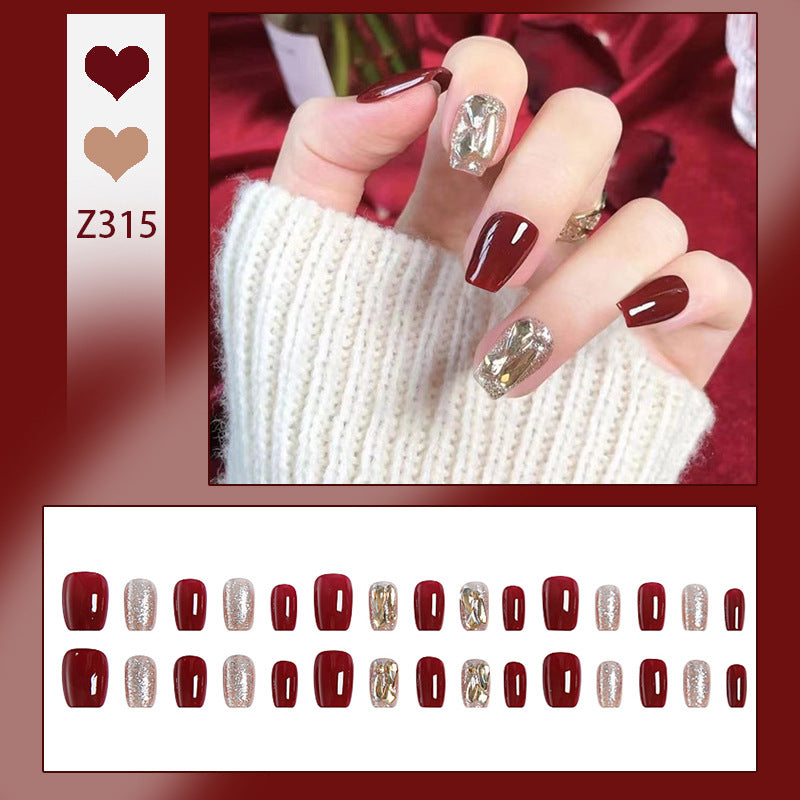 Artificial nail set with elegant glitter and metallic accents Bowlift