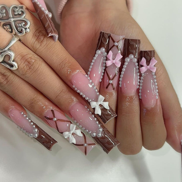 Artificial nail set with stylish 3D bow details and elegant shine Bowlift