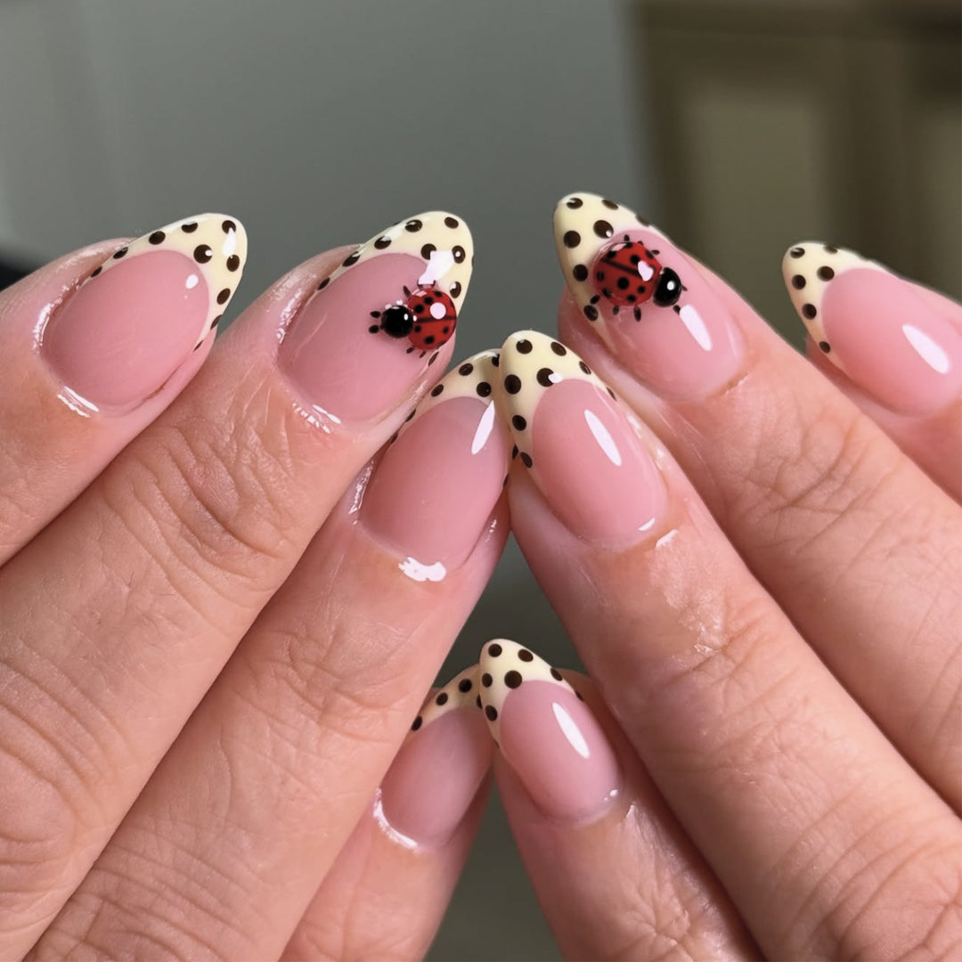 Artful nail art with ladybug motif and polka dots Bowlift