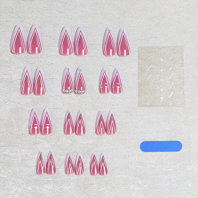 Acrylic nail set with elegant stiletto shape and luxurious embellishments Bowlift