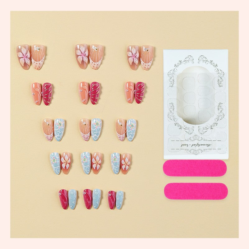 Artificial nail set with floral 3D design and glitter accents Bowlift