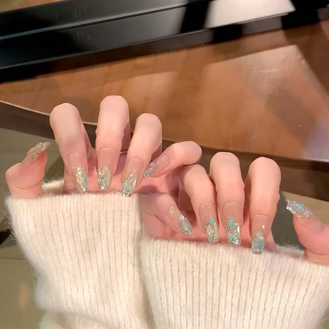 Glamorous nail tips with glitter accents Bowlift