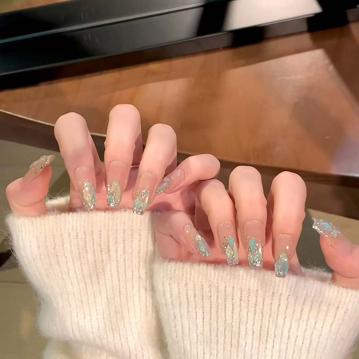 Glamorous nail tips with glitter accents Bowlift
